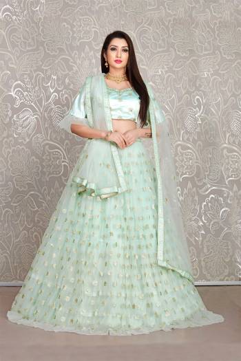 Simple And Elegant Looking Designer Lehenga Choli Is Here In All Over Baby Blue Color. This Lehenga Choli IS Net Based Beautified With Pretty Attractive Embroidered Buttis. 