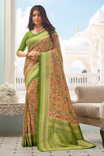 Flaunt Your Rich And Elegant Taste Wearing This Designer Printed Saree In Beige Color Paired With Green Colored Blouse. This Saree And Blouse Are Fabricated On Handloom Silk Beautified With Prints and Weaved Broad Border. 