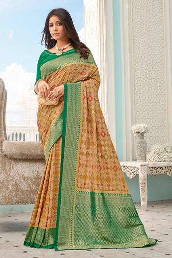 Flaunt Your Rich And Elegant Taste Wearing This Designer Printed Saree In Beige Color Paired With Green Colored Blouse. This Saree And Blouse Are Fabricated On Handloom Silk Beautified With Prints and Weaved Broad Border. 