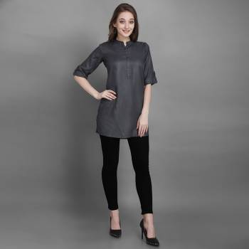 Here Is A Simple And Elegant Looking Readymade Short Kurti For Your Casual Wear In Grey Color. This Plain Kurti Is Fabricated On Rayon , Available In All Regular Sizes. It Can Be Paired With Pants, Leggings Or Denim. 