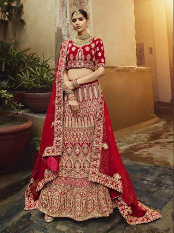 Get Ready For Your D-Day With This Heavy Designer Lehenga Choli In All Over Red Color. This Heavy Embroidered Lehenga Choli Is Fabricated On Velvet Paired With Net Fabricated Dupatta. It Is Beautified With Heavy Coding Jari Embroidery. Buy This Bridal Lehenga Now.