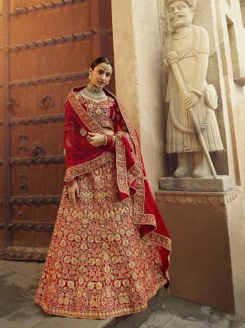 Get Ready For Your D-Day With This Heavy Designer Lehenga Choli In All Over Red Color. This Heavy Embroidered Lehenga Choli Is Fabricated On Velvet Paired With Net Fabricated Dupatta. It Is Beautified With Heavy Coding Jari Embroidery. Buy This Bridal Lehenga Now.