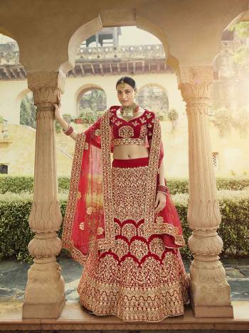 Get Ready For Your D-Day With This Heavy Designer Lehenga Choli In All Over Red Color. This Heavy Embroidered Lehenga Choli Is Fabricated On Velvet Paired With Net Fabricated Dupatta. It Is Beautified With Heavy Coding Jari Embroidery. Buy This Bridal Lehenga Now.