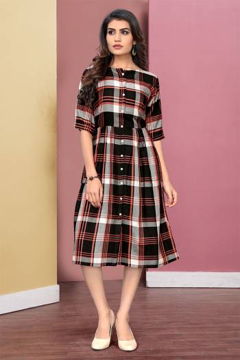 Here Is A Pretty Checks Printed Readymade Kurti Fabricated On Rayon. This Kurti Has Lovely Tunic Pattern Which Is Comfortable And Easy To Carry All Day Long. 