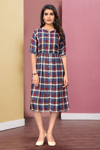 Here Is A Pretty Checks Printed Readymade Kurti Fabricated On Rayon. This Kurti Has Lovely Tunic Pattern Which Is Comfortable And Easy To Carry All Day Long. 