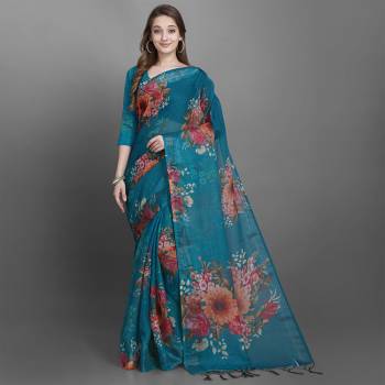 Grab This Beautiful Floral Printed Designer Saree In Blue Color Paired With Blue Colored Blouse. This Saree And Blouse Are Fabricated On Linen Slub Which Is Light Weight, Durable And Easy To Carry All Day Long. 