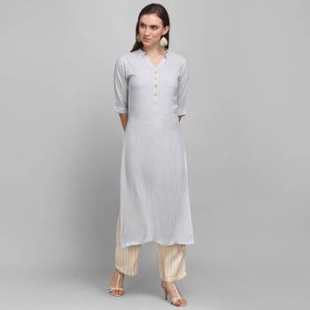 Grab This Simple And Elegant Readymade Pair Of Kurti and Plazzo In Grey And Yellow Color. This Pretty Pair Is Fabricated On Rayon Beautified With Lining Prints. It Is Light In Weight And Easy To Carry All Day Long. 