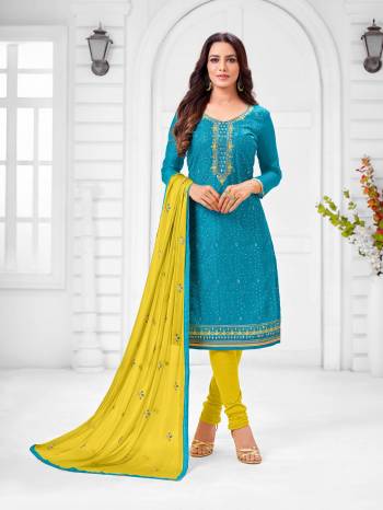 Here Is A Pretty Designer Straight Suit In Blue Color Paired With Contrasting Yellow Colored Bottom and Dupatta. Its Top Is Modal Silk Based Paired With Cotton Bottom and Chiffon Dupatta. All Its Fabrics Are Light Weight And Easy To Carry All Day Long. 