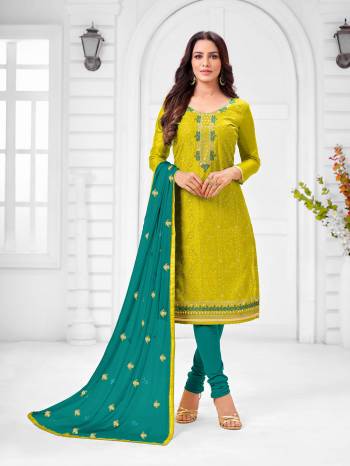 Here Is A Pretty Designer Straight Suit In Pear Green Color Paired With Contrasting Blue Colored Bottom and Dupatta. Its Top Is Modal Silk Based Paired With Cotton Bottom and Chiffon Dupatta. All Its Fabrics Are Light Weight And Easy To Carry All Day Long. 