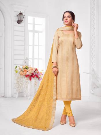 Grab This Designer Straight Suit For Your Semi-Casual Wear In Beige Color Paired With Yellow Colored Bottom and Dupatta. Its Top and Dupatta Are Modal Silk Based Paired With Cotton Bottom.