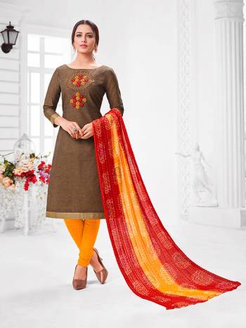 Here Is A Pretty Designer Straight Suit In Brown Color Paired With Contrasting Musturd Yellow And Red Colored Bottom and Dupatta. Its Top Is Modal Silk Based Paired With Cotton Bottom and Chiffon Dupatta. All Its Fabrics Are Light Weight And Easy To Carry All Day Long. 