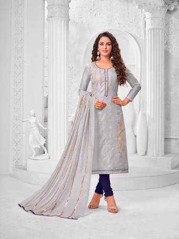 Grab This Designer Straight Suit For Your Semi-Casual Wear In Light Grey Color Paired With Navy Blue Colored Bottom And Light Grey Colored Dupatta. Its Top Is Fabricated On Modal Silk Paired With Cotton Bottom And Dupatta. 