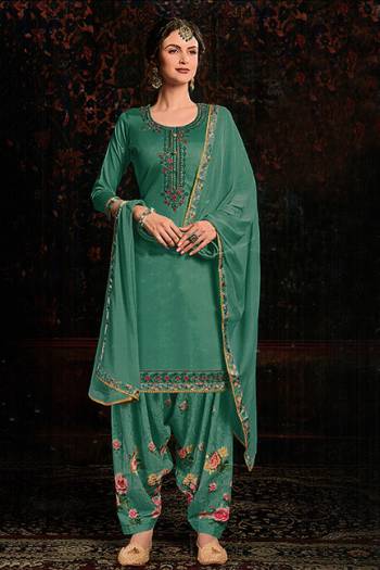 Grab This Beautiful Designer Suit For This Festive Season In Sea Green color. Its Embroidered Top Is Fabricated On Cotton Satin Paired With Floral Printed Cotton Bottom And Chiffon Fabricated Dupatta. 