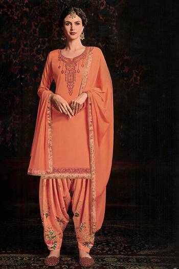 Add Designer Patiala Suit To Your Wardrobe In Orange Color. Its Top IS Fabricated On Cotton Satin Paired With Cotton Bottom And Chiffon Fabricated Dupatta. It Is Beautified With Floral Printed Bottom And Embroidered Top. 