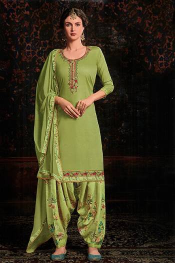 Grab This Beautiful Designer Suit For This Festive Season In Light Green color. Its Embroidered Top Is Fabricated On Cotton Satin Paired With Floral Printed Cotton Bottom And Chiffon Fabricated Dupatta. 