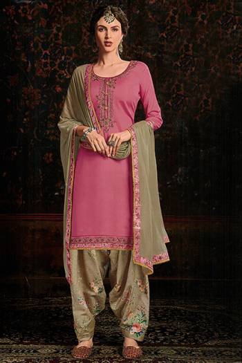 Add Designer Patiala Suit To Your Wardrobe In Pink Colored Top Paired With Beige Colored Bottom And Dupatta. Its Top IS Fabricated On Cotton Satin Paired With Cotton Bottom And Chiffon Fabricated Dupatta. It Is Beautified With Floral Printed Bottom And Embroidered Top. 