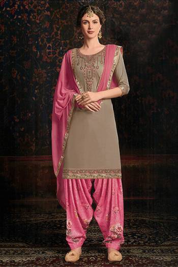 Add Designer Patiala Suit To Your Wardrobe In Sand Grey Colored Top Paired With Pink Colored bottom and Dupatta. Its Top IS Fabricated On Cotton Satin Paired With Cotton Bottom And Chiffon Fabricated Dupatta. It Is Beautified With Floral Printed Bottom And Embroidered Top. 