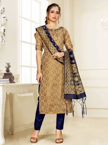 Grab This Pretty Designer Straight Suit In Beige Color Paired With Navy Blue Colored Bottom And Dupatta. Its Top, Bottom And Dupatta Are Fabricated On Cotton Silk Beautified With Weave. 