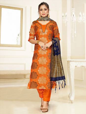 Celebrate This Festive Season Wearing this Designer Straight Suit In Orange Color Paired With Navy Blue Colored Dupatta. Its Top, Bottom And Dupatta Are Fabricated Banarasi Art Silk Beautified With Weave. Buy This  Suit Now.