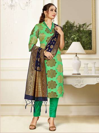 Celebrate This Festive Season Wearing this Designer Straight Suit In Light Green Color Paired With Navy Blue Colored Dupatta. Its Top, Bottom And Dupatta Are Fabricated Banarasi Art Silk Beautified With Weave. Buy This  Suit Now.