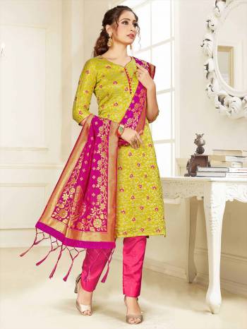 Celebrate This Festive Season Wearing this Designer Straight Suit In Pear Green  And Rani Pink Color Paired With Rani Pink Colored Dupatta. Its Top, Bottom And Dupatta Are Fabricated Banarasi Art Silk Beautified With Weave. Buy This  Suit Now.