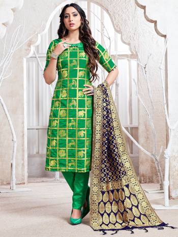 Celebrate This Festive Season In A Proper Traditional Look Wearing This Weaved Straight Suit In Green Color Paired with Navy Blue Colored Dupatta. This Pretty Suit Is Fabricated On Banarasi Silk Beautified With Weave. 