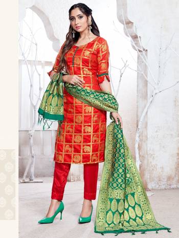 Here Is A Rich And Elegant Looking Silk Based Straight Suit In Red Color Paired With Green Colored Dupatta. Its Top, Bottom And Dupatta Are Fabricated On Banarasi Silk Beautified With Attractive Weave. Buy Now.