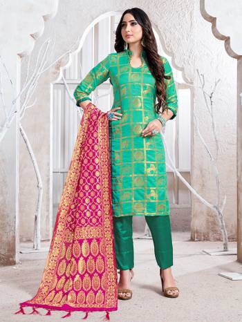 Celebrate This Festive Season In A Proper Traditional Look Wearing This Weaved Straight Suit In Sea Green Color Paired with Rani Pink Colored Dupatta. This Pretty Suit Is Fabricated On Banarasi Silk Beautified With Weave. 