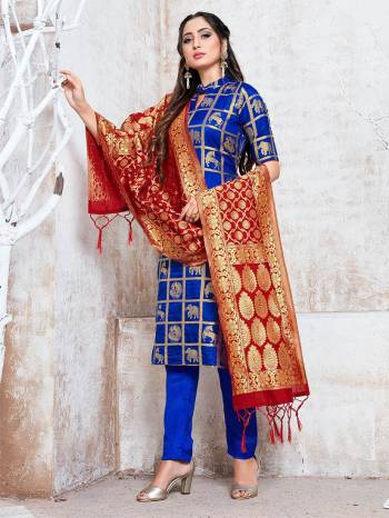 Celebrate This Festive Season In A Proper Traditional Look Wearing This Weaved Straight Suit In Royal Blue Color Paired with Maroon Colored Dupatta. This Pretty Suit Is Fabricated On Banarasi Silk Beautified With Weave. 