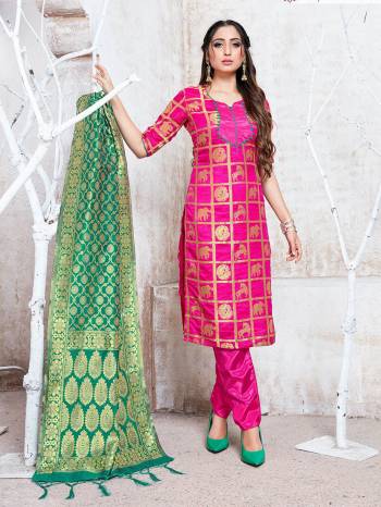 Here Is A Rich And Elegant Looking Silk Based Straight Suit In Rani Pink Color Paired With Sea Green Colored Dupatta. Its Top, Bottom And Dupatta Are Fabricated On Banarasi Silk Beautified With Attractive Weave. Buy Now.