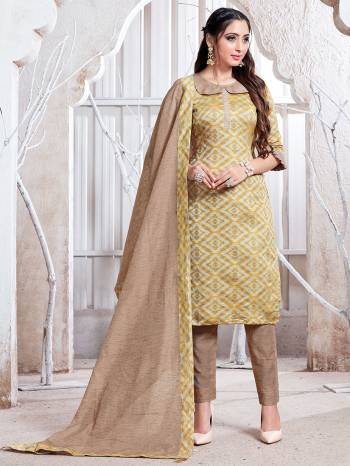 Add This Pretty Simple Straight Suit To Your Wardrobe In Musturd & Beige Color. This Suit Is Fabricated On Cotton Silk Which Is Durable, Soft Towards Skin And Easy To Carry All Day Long. 