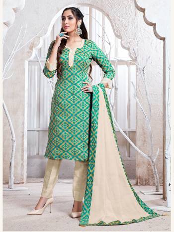 Flaunt Your Rich And Elegant Taste Wearing This Pretty Sea Green And Cream Colored Straight Suit. Its Top, Bottom And Dupatta Are Fabricated On Cotton Silk Which Gives A Rich Look To Your Personality. 