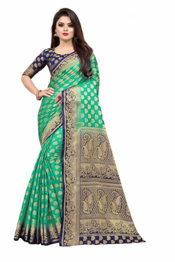 Celebrate This Festive Season In A Proper Traditonal Look Wearing This Silk Based Saree In Sea Green Color Paired With Royal Blue Colored Blouse. This Saree And Blouse Are Fabricated On Art Silk Beautified with Weave. 