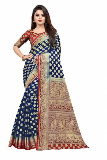 Celebrate This Festive Season In A Proper Traditonal Look Wearing This Silk Based Saree In Royal Blue Color Paired With Red Colored Blouse. This Saree And Blouse Are Fabricated On Art Silk Beautified with Weave. 