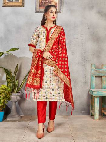 Grab This Pretty Designer Straight Suit In Off-White And Red Color. Its Top, Bottom And Dupatta Are Fabricated On Banarasi Art Silk Beautified With Weave. Its Fabric and Color Gives A Rich Look To Your Perosnality. 