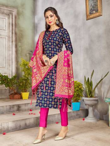 Celebrate This Festive Season Wearing this Designer Straight Suit In Navy Blue And Rani Pink Color. Its Top, Bottom And Dupatta Are Fabricated Banarasi Art Silk Beautified With Weave. Buy This  Suit Now.