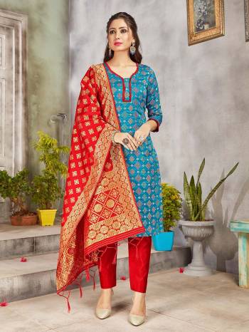 Grab This Pretty Designer Straight Suit In Blue And Red. Its Top, Bottom And Dupatta Are Fabricated On Banarasi Art Silk Beautified With Weave. Its Fabric and Color Gives A Rich Look To Your Perosnality. 