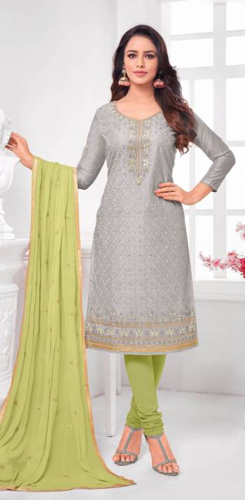 Here Is A Pretty Designer Straight Suit In Grey Color Paired With Contrasting Light Green Colored Bottom and Dupatta. Its Top Is Modal Silk Based Paired With Cotton Bottom and Chiffon Dupatta. All Its Fabrics Are Light Weight And Easy To Carry All Day Long