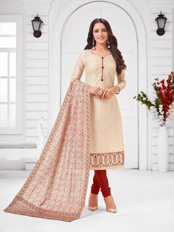 Grab This Designer Straight Suit For Your Semi-Casual Wear In Cream Color Paired With Maroon Colored Bottom and Cream Dupatta. Its Top and Dupatta Are Modal Silk Based Paired With Cotton Bottom.