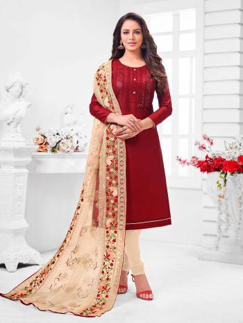 Simple And Elegant Looking Designer Straight Suit Is Here In Maroon Color Paired With Cream Colored bottom And Dupatta. Its Top Is Fabricated On Coral Silk Paired With Cotton Bottom and Orgenza Dupatta.