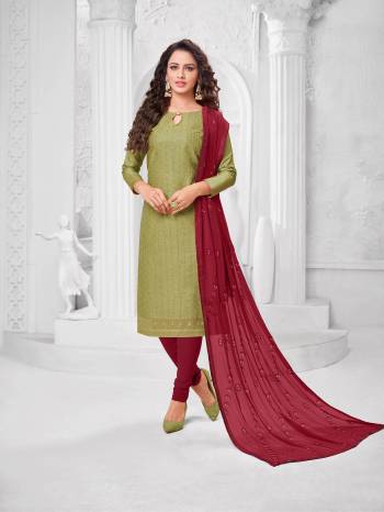 Here Is A Pretty Designer Straight Suit In Olive Green Color Paired With?Contrasting Magenta Pink Colored Bottom and Dupatta. Its Top Is Cotton Silk Based Paired With Cotton Bottom and Chiffon Dupatta. All Its Fabrics Are Light Weight And Easy To Carry All Day Long.