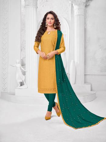 Here Is A Pretty Designer Straight Suit In Musturd Yellow Color Paired With?Contrasting Teal Blue Colored Bottom and Dupatta. Its Top Is Cotton Silk Based Paired With Cotton Bottom and Chiffon Dupatta. All Its Fabrics Are Light Weight And Easy To Carry All Day Long.