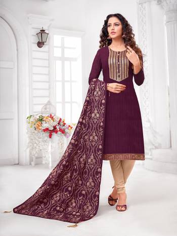 Grab This Designer Straight Suit For Your Semi-Casual Wear In Wine Colored Top and Dupatta Paired With Cream Colored Bottom. Its Top and Dupatta Are Art Silk Based Paired With Cotton Bottom.