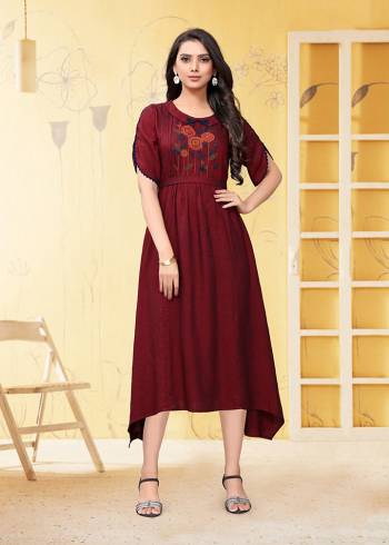 Add This Pretty Readymade Kurti To Your Wardrobe In Maroon Color. This Kurti Is Fabricated On Linen Beautified With Thread Work. 