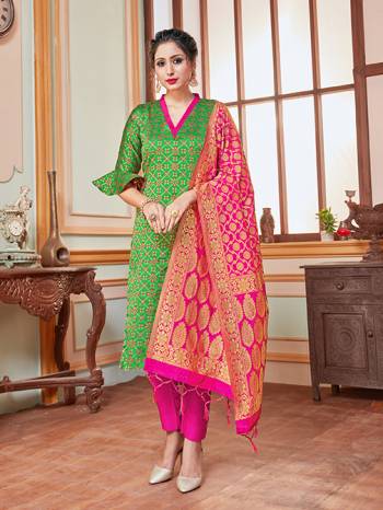 Here Is A Rich And Elegant Looking Silk Based Straight Suit In Green Colored Top Paired With Contrasting Rani Pink Colored Bottom And Dupatta. Its Top, Bottom And Dupatta Are Fabricated On Banarasi Silk Beautified With Heavy Detailed Weave.