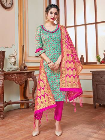 Celebrate This Festive Season In A Proper Traditional Look Wearing This Weaved Straight Suit In Turquoise Blue Colored Top Paired With Contrasting Rani Pink Colored Bottom And Dupatta. This Pretty Suit Is Banarasi Silk Based Beautified With Weave. Its Fabric Gives A Rich Look To Your Personality. 