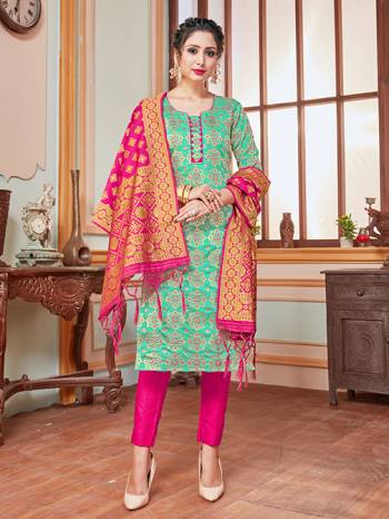 Here Is A Rich And Elegant Looking Silk Based Straight Suit In Sea Green Colored Top Paired With Contrasting Rani Pink Colored Bottom And Dupatta. Its Top, Bottom And Dupatta Are Fabricated On Banarasi Silk Beautified With Heavy Detailed Weave.