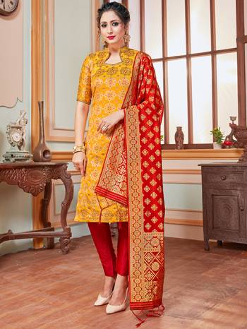 Celebrate This Festive Season In A Proper Traditional Look Wearing This Weaved Straight Suit In Musturd Yellow Colored Top Paired With Contrasting Red Colored Bottom And Dupatta. This Pretty Suit Is Banarasi Silk Based Beautified With Weave. Its Fabric Gives A Rich Look To Your Personality. 