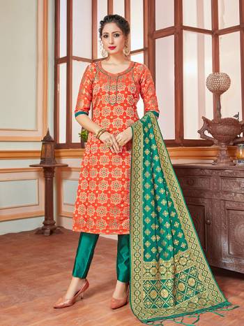 Celebrate This Festive Season In A Proper Traditional Look Wearing This Weaved Straight Suit In Orange Colored Top Paired With Contrasting Sea Green Colored Bottom And Dupatta. This Pretty Suit Is Banarasi Silk Based Beautified With Weave. Its Fabric Gives A Rich Look To Your Personality. 