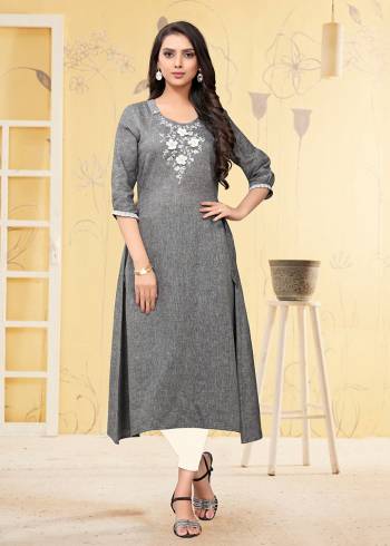 Add This Pretty Readymade Kurti To Your Wardrobe In Grey Color. This Kurti Is Fabricated On Linen Beautified With Thread Work. 